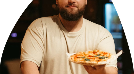 Person holding pizza